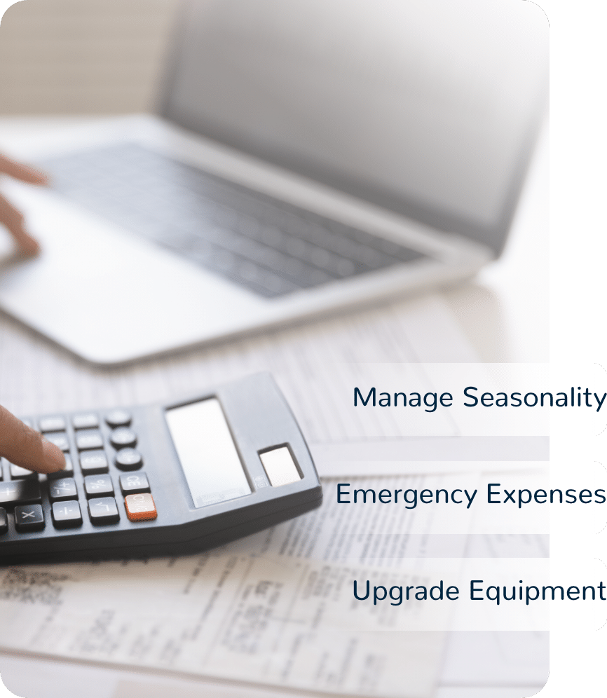 Person on laptop and calculator, words say manage seasonality, emergency expenses, and upgrade equiptment