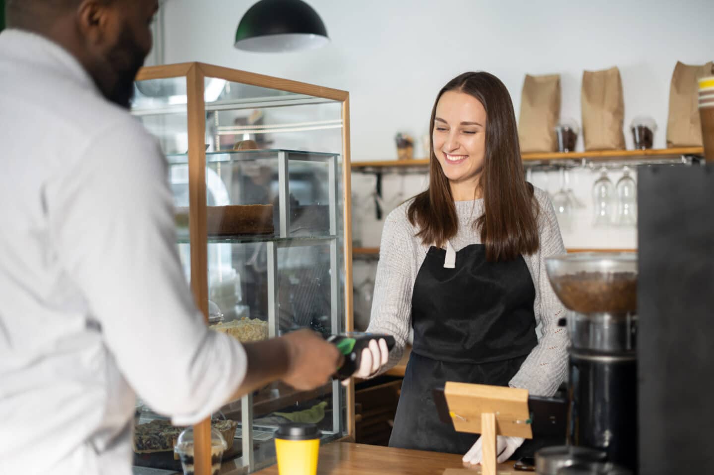 girl checking out customer